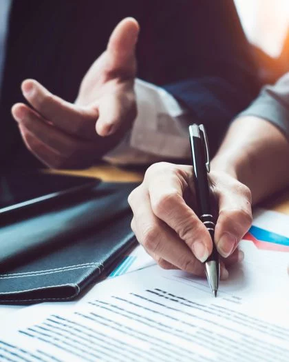 Businessperson signs a legal document